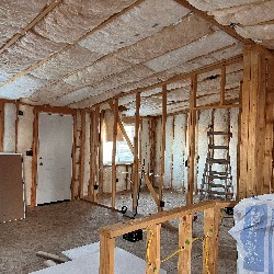 An image showing the interior of a student-built house under construction.